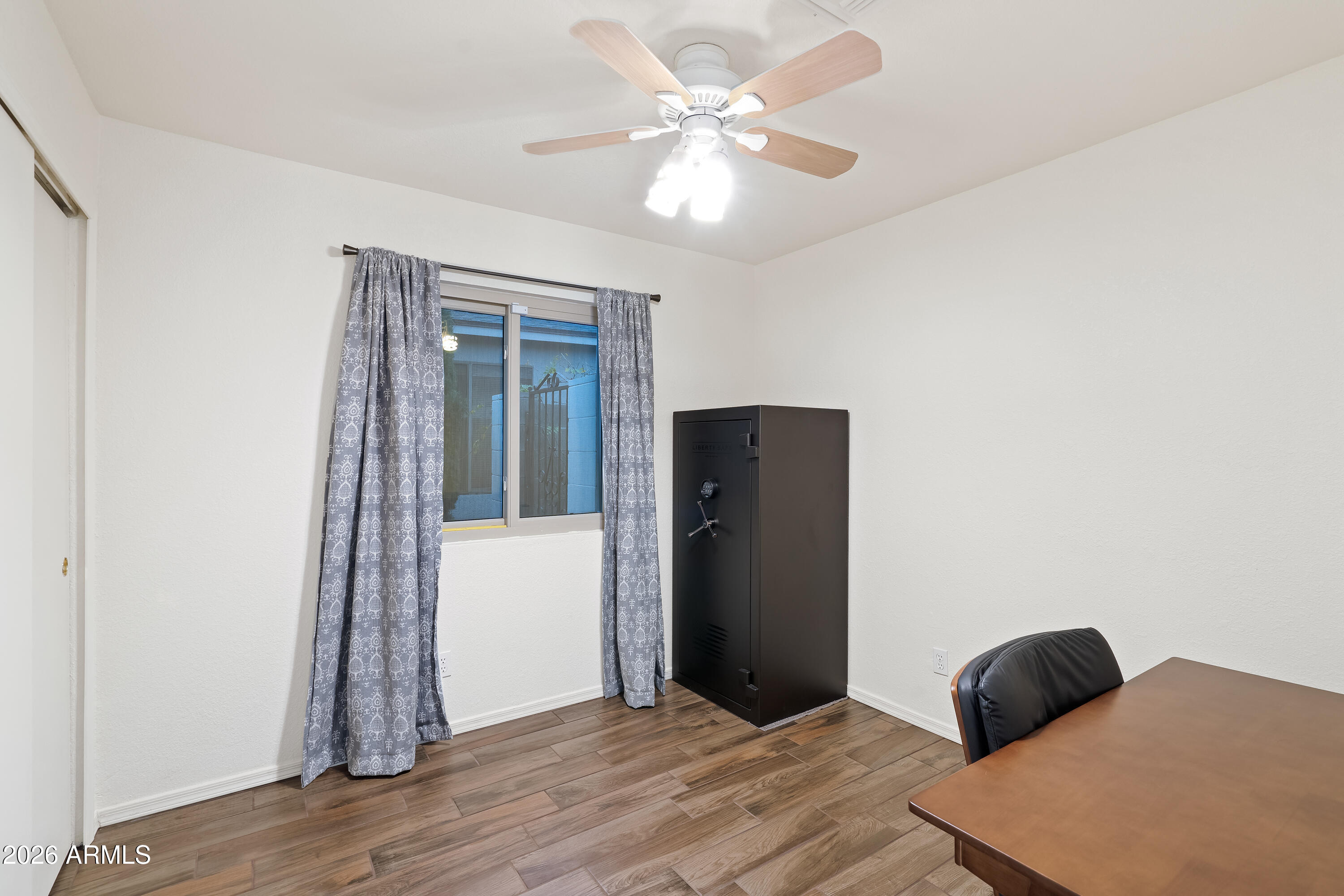 4591 Territorial Loop Sierra Vista, AZ 85635 - Photo 18 of 27 a bedroom with a bed and a window
