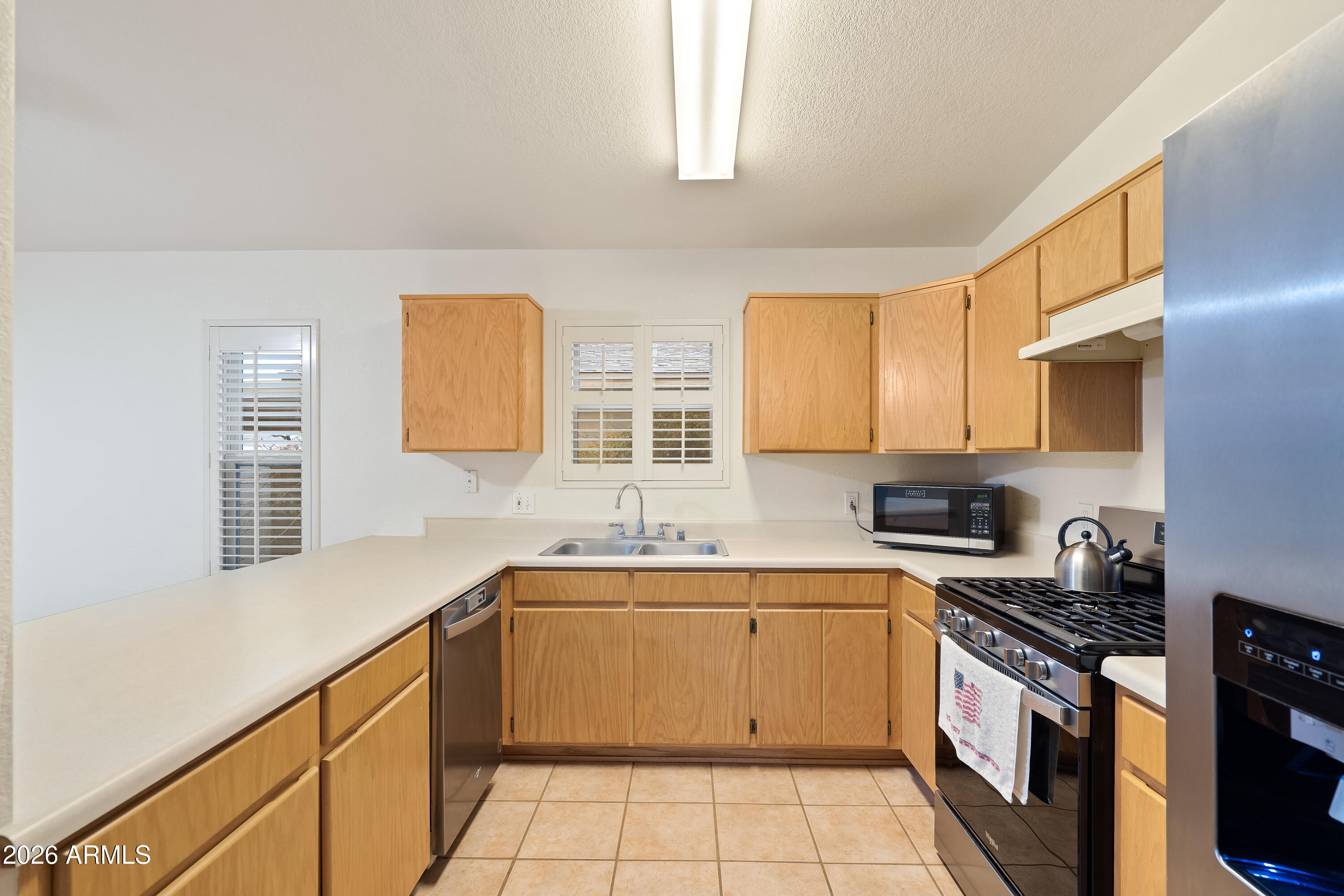 4591 Territorial Loop Sierra Vista, AZ 85635 - Photo 8 of 27 a kitchen with a sink stove and cabinets