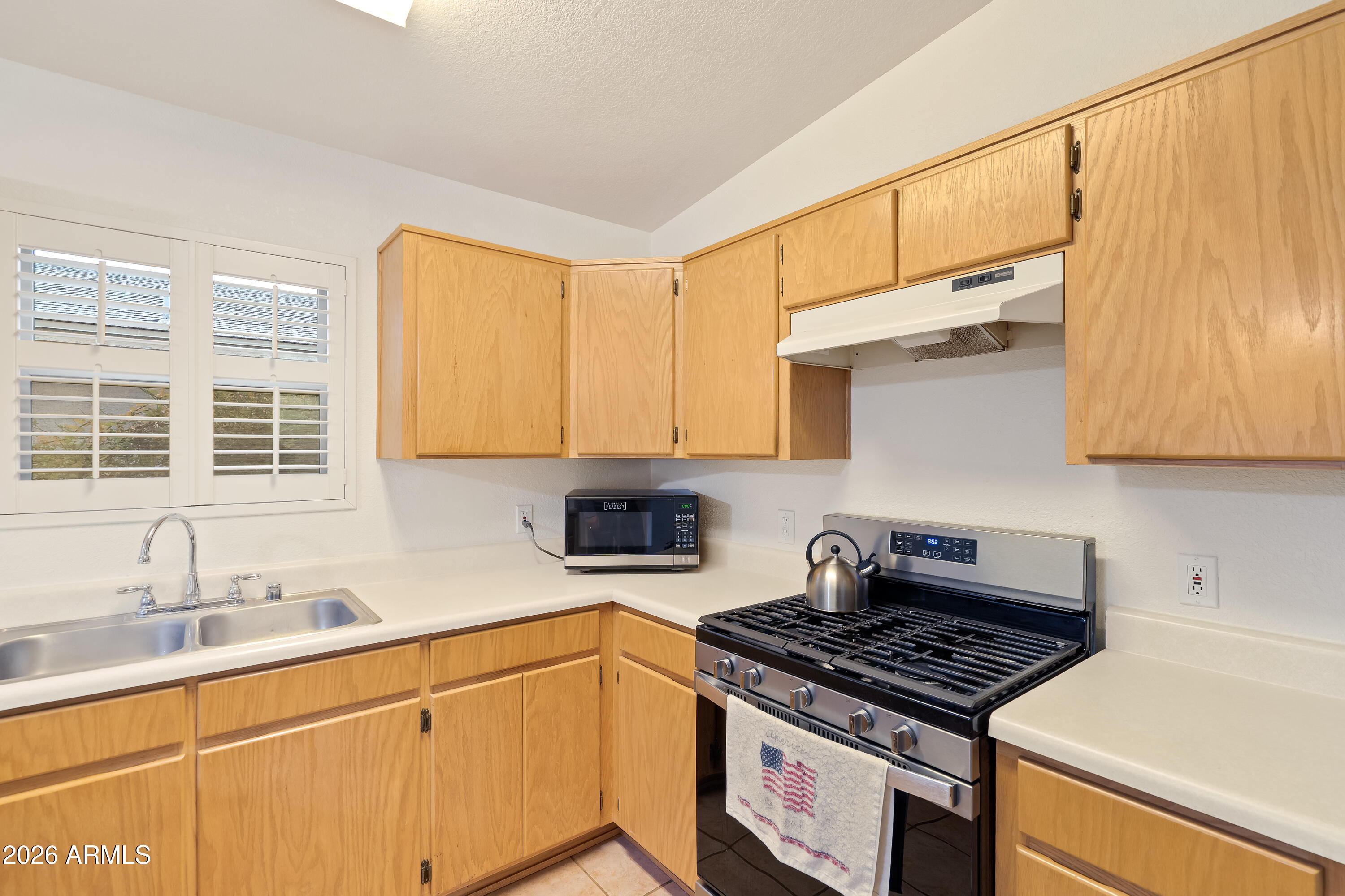 4591 Territorial Loop Sierra Vista, AZ 85635 - Photo 9 of 27 a kitchen with stainless steel appliances granite countertop a sink stove and cabinets