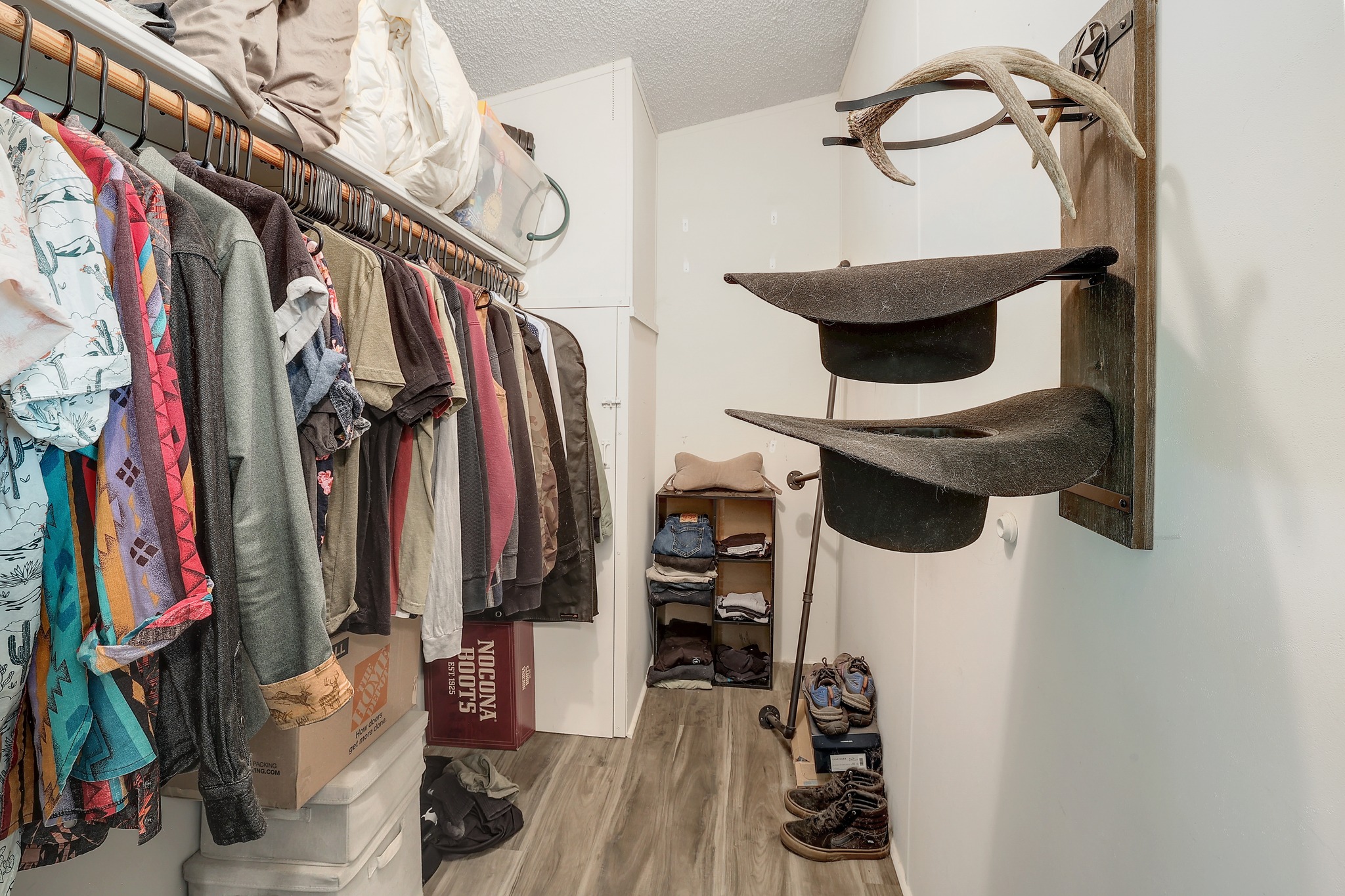 288 The Forest Road Dale, TX 78616 - Photo 17 of 31 a view of walk in closet with clothes and shoes