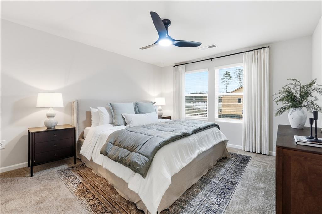 3227 Winding Waters Way, Unit 36 Powder Springs, GA 30127 - Photo 15 of 30 a bed room with a bed and a television