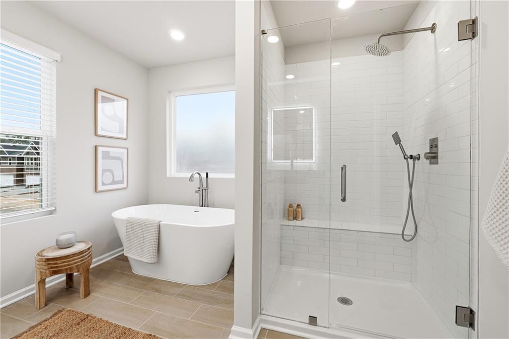 3227 Winding Waters Way, Unit 36 Powder Springs, GA 30127 - Photo 18 of 30 a bathroom with a sink toilet and shower