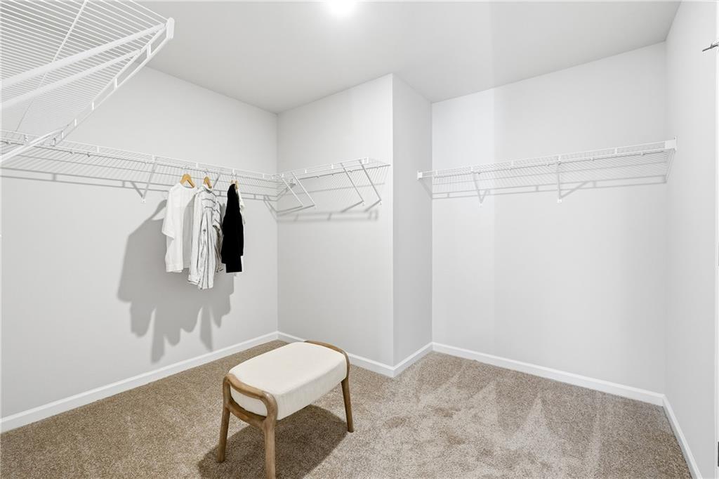 3227 Winding Waters Way, Unit 36 Powder Springs, GA 30127 - Photo 19 of 30 a bathroom with a toilet and a shower