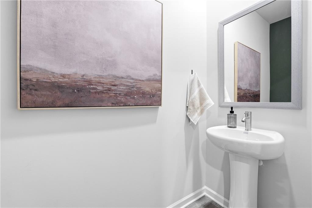 3227 Winding Waters Way, Unit 36 Powder Springs, GA 30127 - Photo 25 of 30 a bathroom with a sink and a mirror