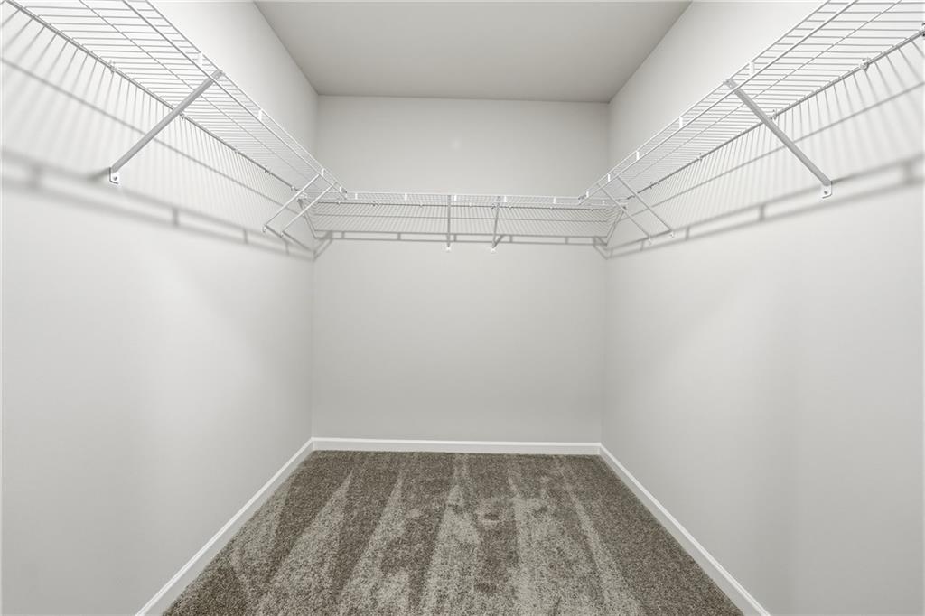 3227 Winding Waters Way, Unit 36 Powder Springs, GA 30127 - Photo 26 of 30 a view of a room with racks on the wall