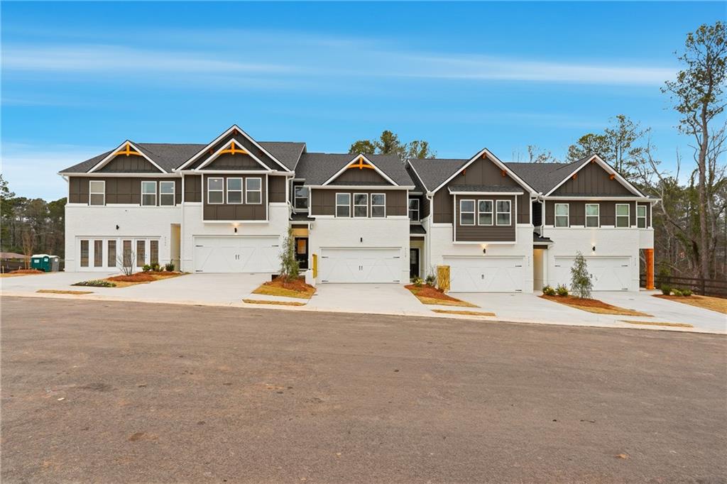3227 Winding Waters Way, Unit 36 Powder Springs, GA 30127 - Photo 3 of 30 a front view of a house with a yard