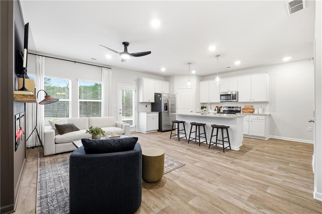 3227 Winding Waters Way, Unit 36 Powder Springs, GA 30127 - Photo 6 of 30 a living room with furniture and a large window