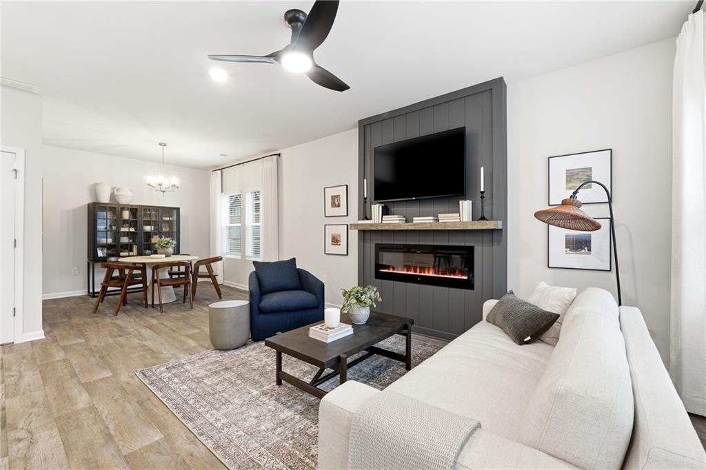 3227 Winding Waters Way, Unit 36 Powder Springs, GA 30127 - Photo 7 of 30 a living room with furniture and a flat screen tv