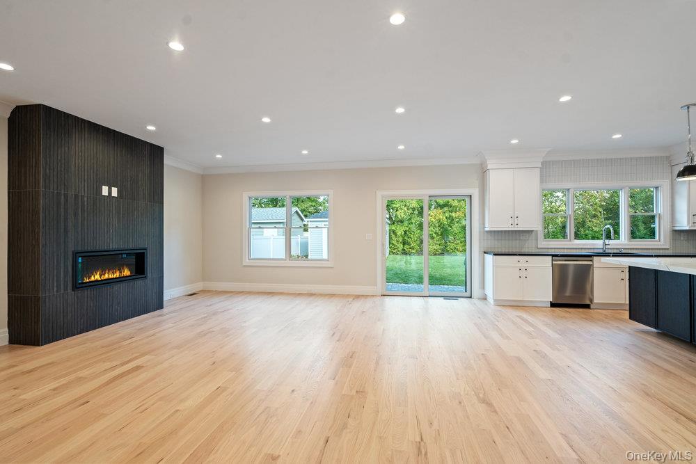 47 Netz Place Albertson, NY 11507 - Photo 41 of 41 Kitchen with crown molding, open floor plan, recessed lighting, light wood finished floors, and healthy amount of natural light