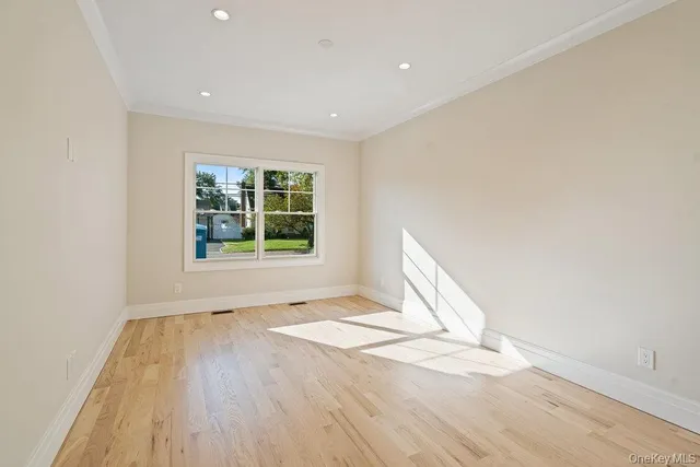 a large kitchen with a lot of counter space and a refrigerator