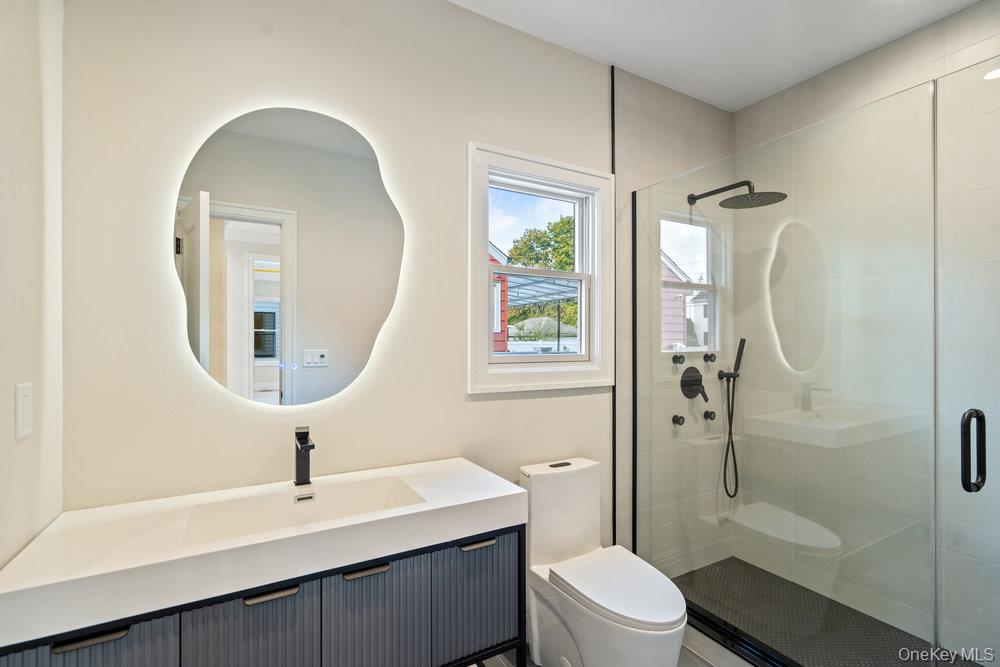 47 Netz Place Albertson, NY 11507 - Photo 17 of 41 Full bath with a shower stall and vanity