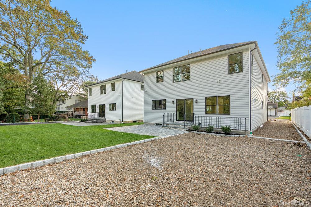47 Netz Place Albertson, NY 11507 - Photo 33 of 41 Rear view of house with a patio