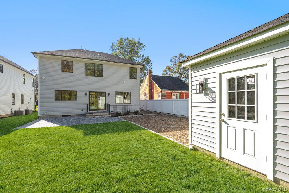 47 Netz Place Albertson, NY 11507 - Photo 35 of 41 Rear view of house featuring a patio