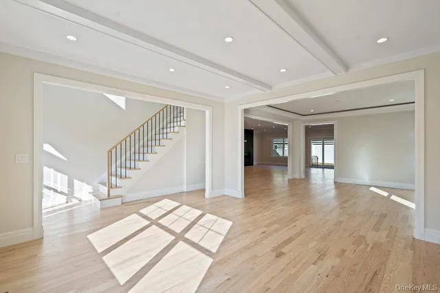 a view of interior space with wooden floor and stairs
