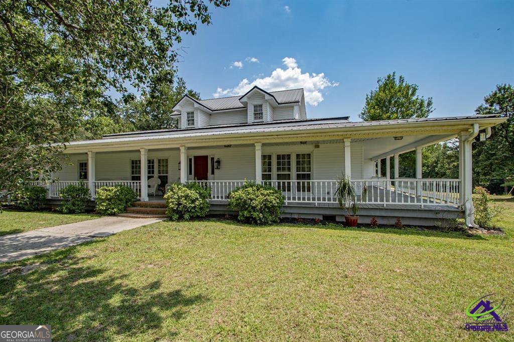 1441 Zenith Mill Road Roberta, GA 31078 - Photo 1 of 80 a view of a house with a yard and potted plants
