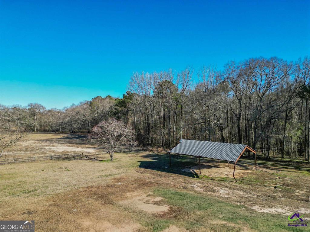 1441 Zenith Mill Road Roberta, GA 31078 - Photo 13 of 80 a wooden bench sitting in the middle of a yard
