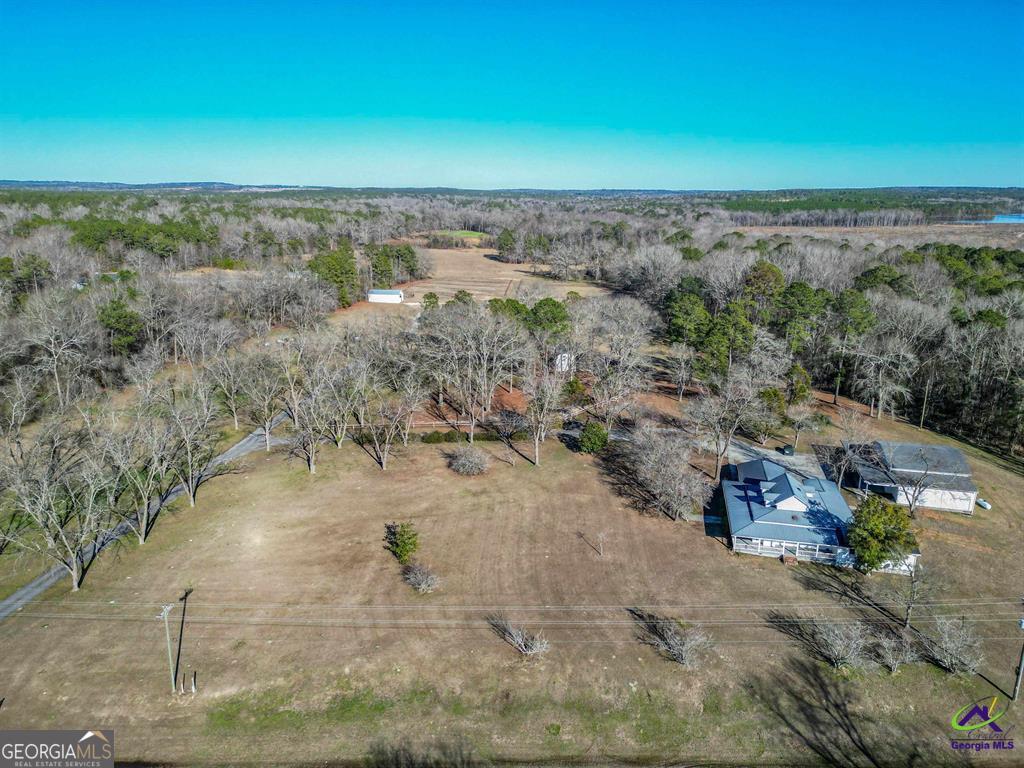1441 Zenith Mill Road Roberta, GA 31078 - Photo 18 of 80 a view of a dry yard with wooden fence