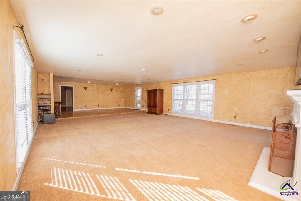 1441 Zenith Mill Road Roberta, GA 31078 - Photo 30 of 80 a view of an empty room with a fireplace