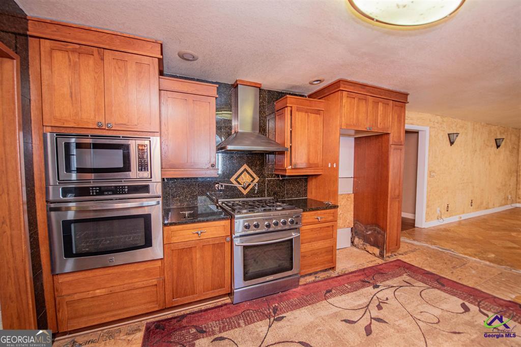1441 Zenith Mill Road Roberta, GA 31078 - Photo 36 of 80 a kitchen with a stove and a microwave