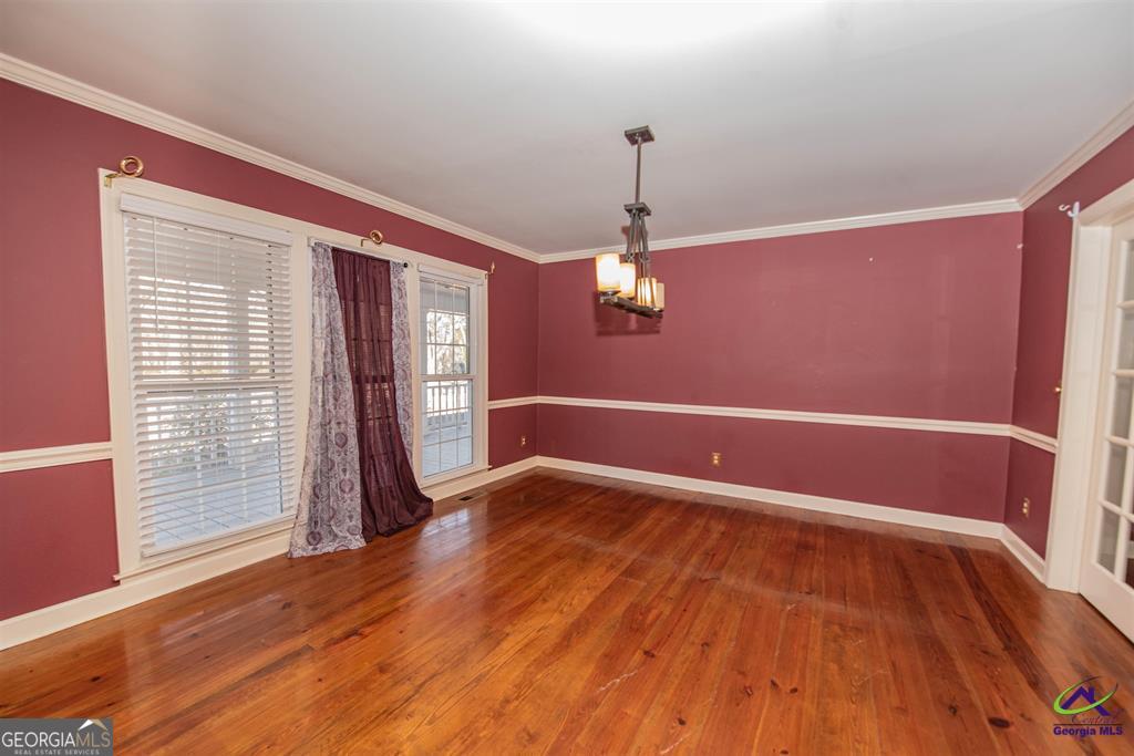 1441 Zenith Mill Road Roberta, GA 31078 - Photo 50 of 80 a view of empty room with wooden floor and fan