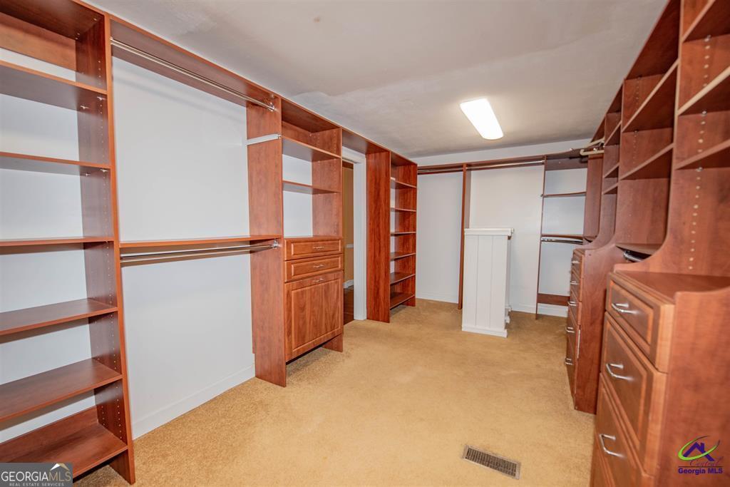 1441 Zenith Mill Road Roberta, GA 31078 - Photo 57 of 80 a view of empty room with wooden floor and fan