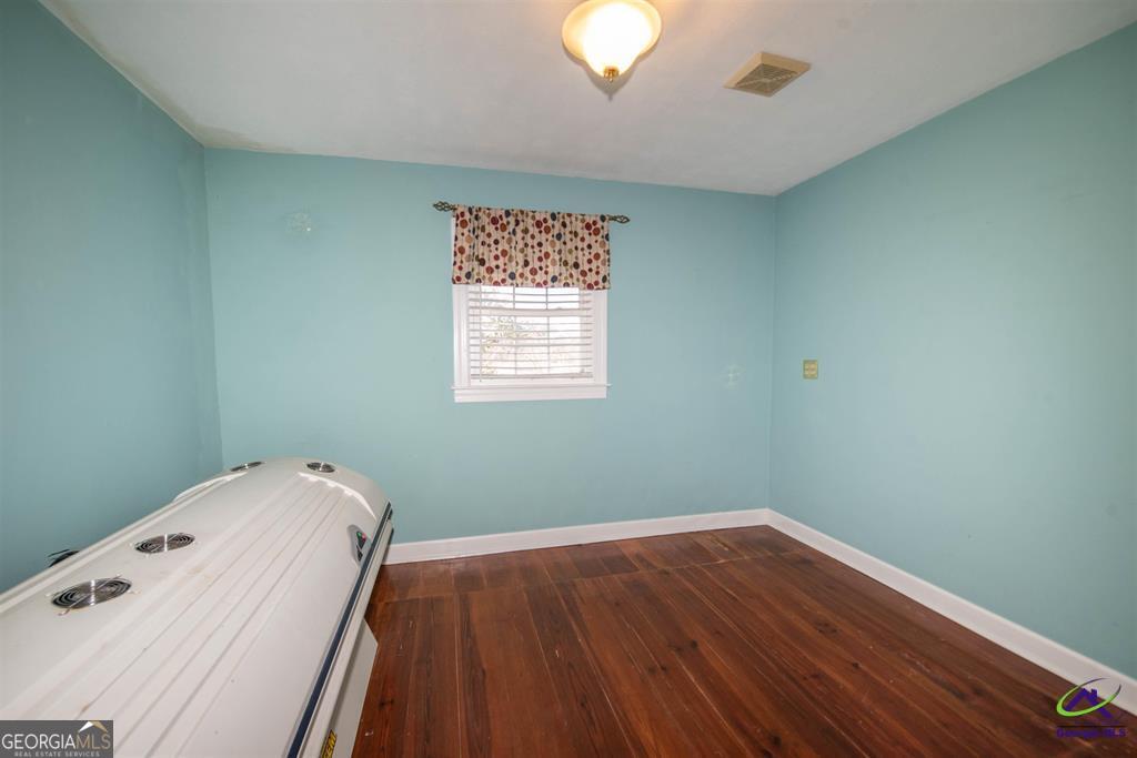 1441 Zenith Mill Road Roberta, GA 31078 - Photo 58 of 80 a view of a hallway with wooden floor and a window