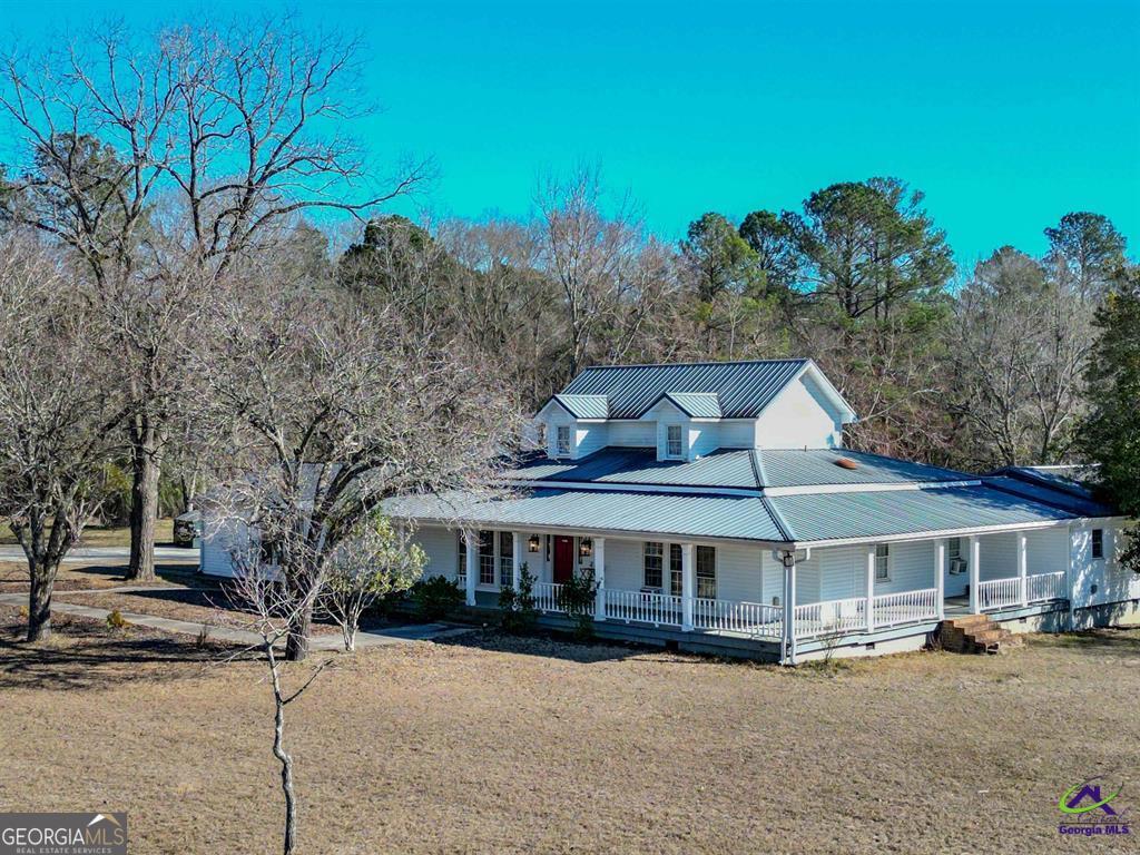 1441 Zenith Mill Road Roberta, GA 31078 - Photo 6 of 80 a front view of a house with a garden