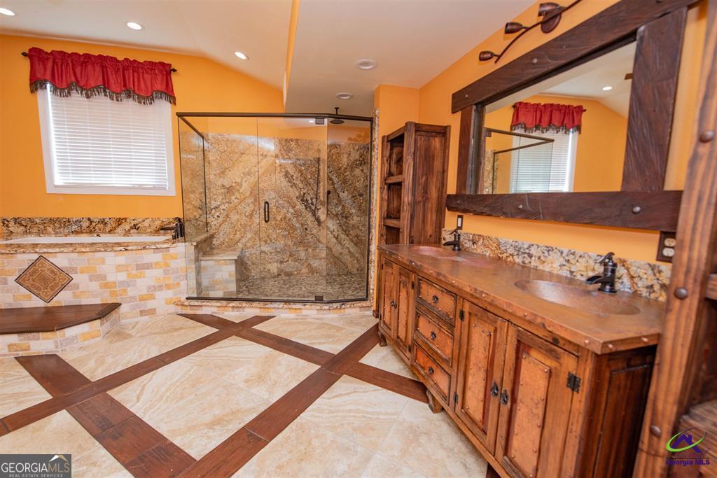 1441 Zenith Mill Road Roberta, GA 31078 - Photo 62 of 80 a bathroom with a sink a mirror and a shower