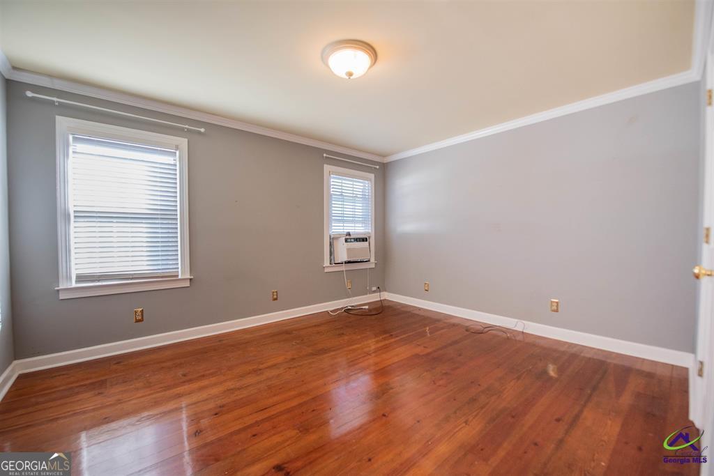 1441 Zenith Mill Road Roberta, GA 31078 - Photo 72 of 80 a view of an empty room with wooden floor and a window