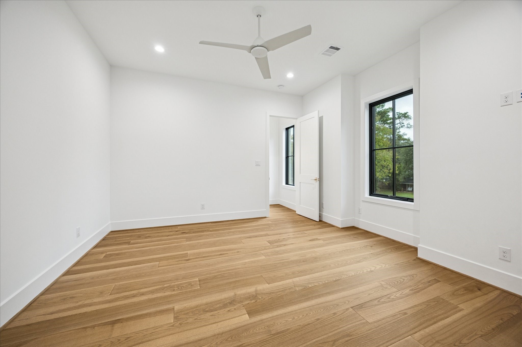830 Azalea Street Houston, TX 77018 - Photo 24 of 50 Bright natural light, wide-plank oak floors, Emtek hardware, and tall 8 ft doors create a modern, elevated feel.