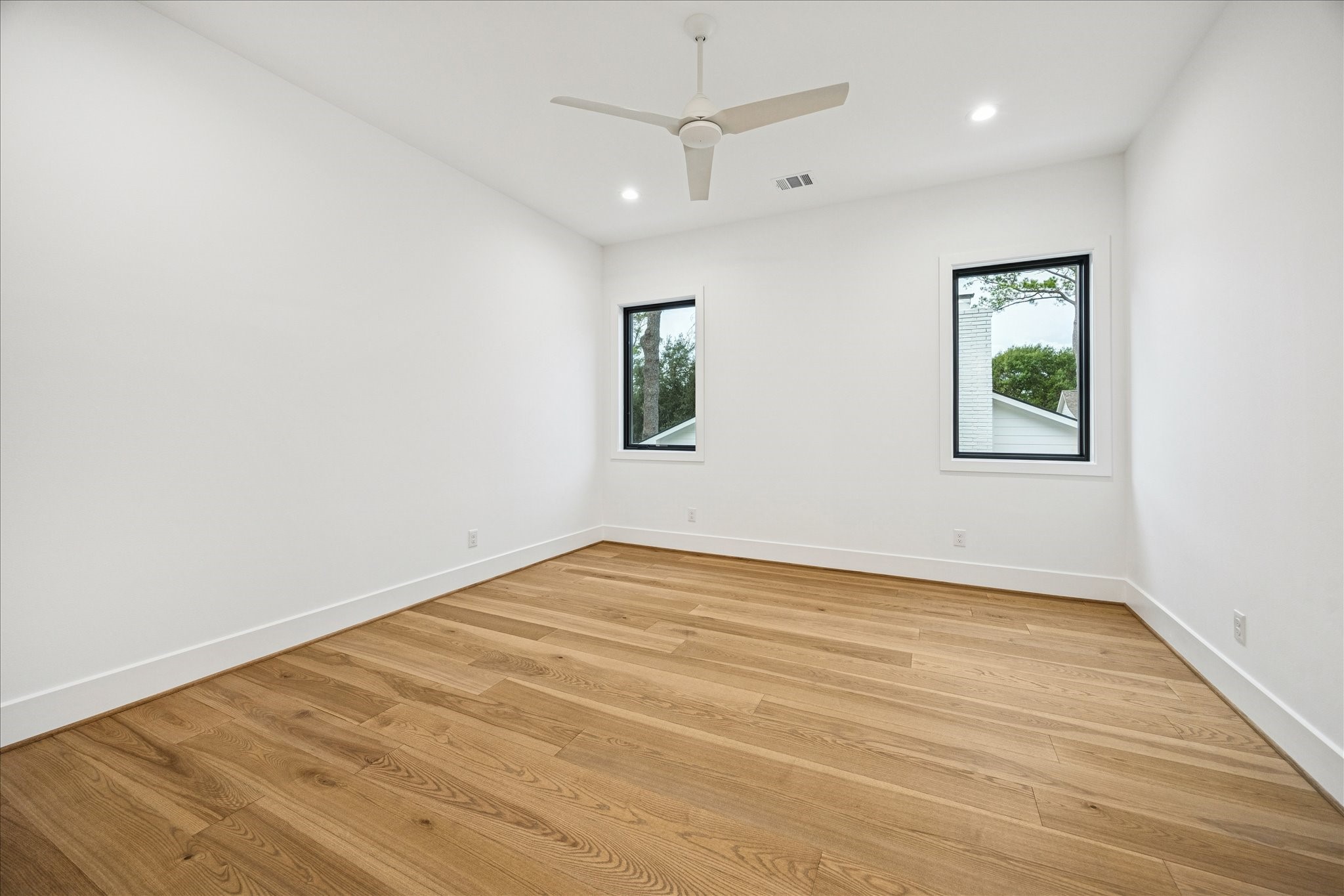 830 Azalea Street Houston, TX 77018 - Photo 26 of 50 A bright, comfortable space with its own en-suite bath, insulated with open-cell spray foam for quiet, energy-efficient living.
