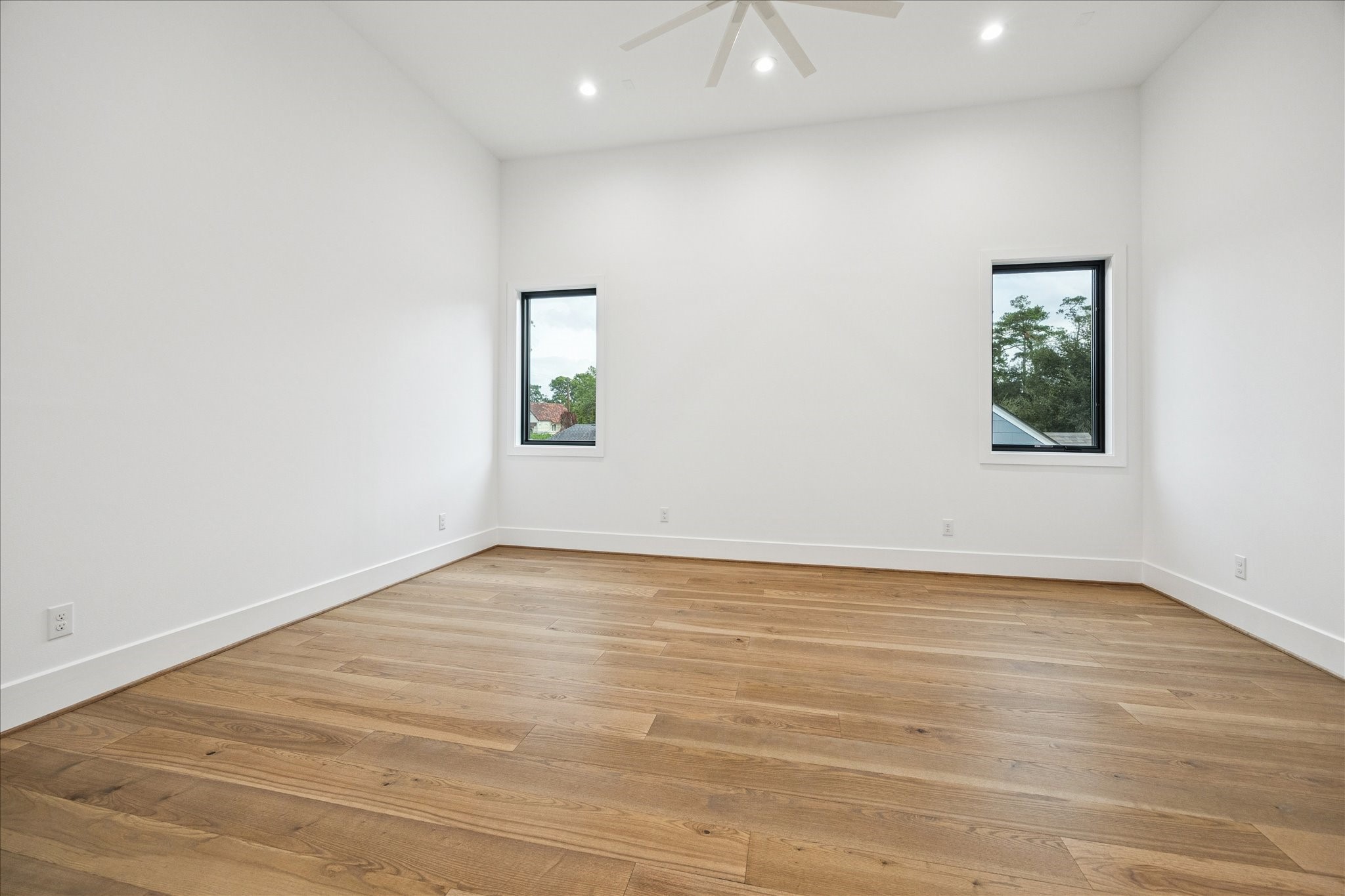 830 Azalea Street Houston, TX 77018 - Photo 30 of 50 Wide-plank oak floors and abundant natural light give the gameroom a flexible, bright layout. Pella Reserve windows and the Trane zoned HVAC system support year-round comfort.