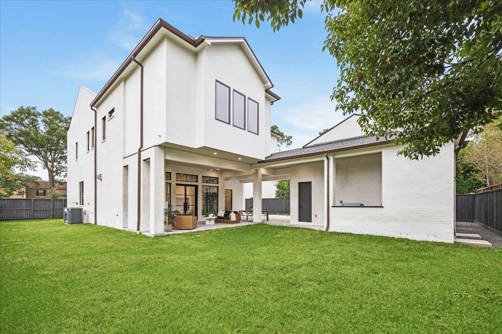 830 Azalea Street Houston, TX 77018 - Photo 34 of 50 A generous lawn provides space for a pool, gardening, or play. The home is pre-plumbed for a Generac system for added peace of mind.