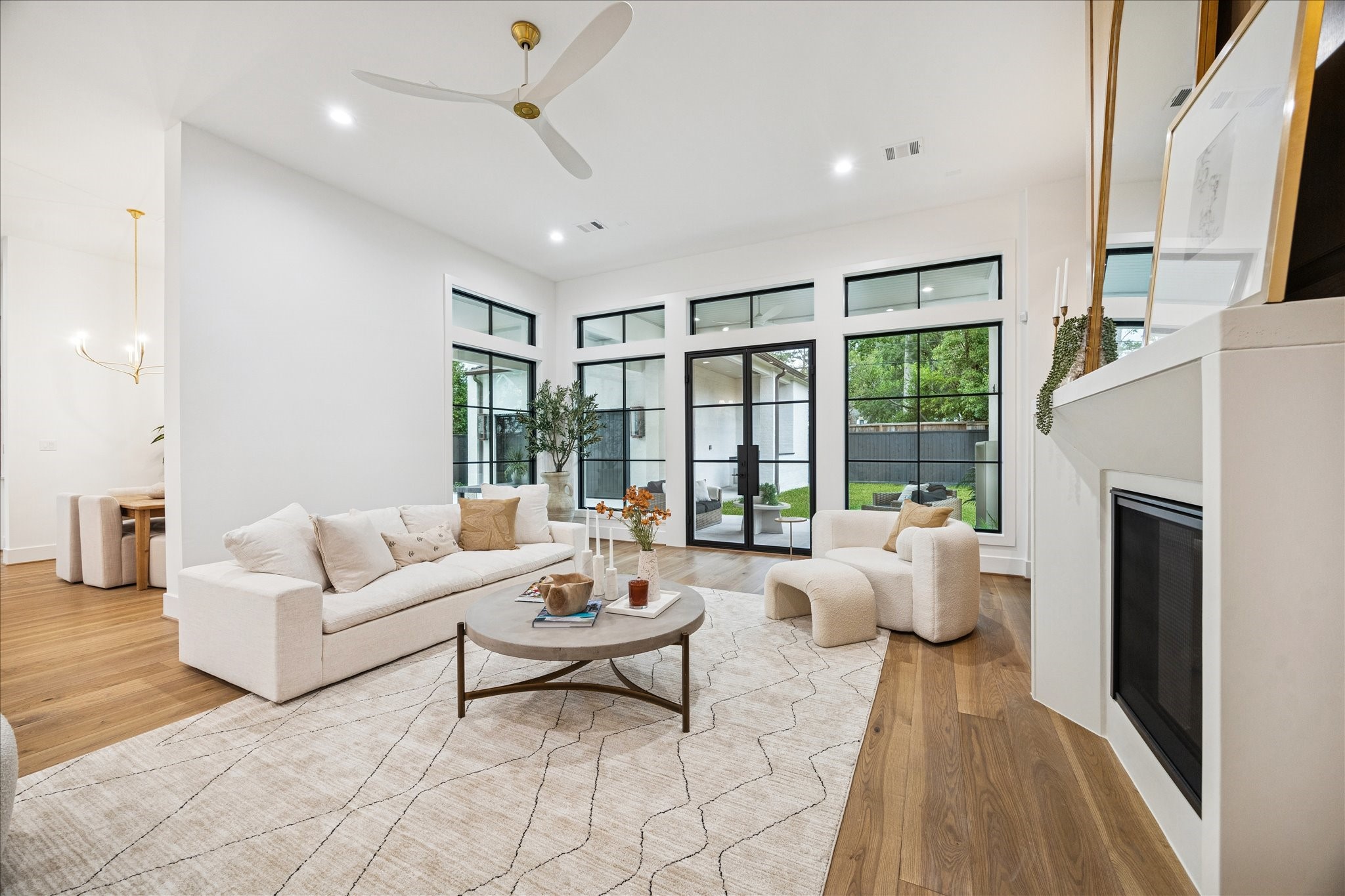 830 Azalea Street Houston, TX 77018 - Photo 10 of 50 Thoughtfully placed openings, consistent flooring, and 8 ft doors create a seamless progression into the kitchen. Spray foam insulation and zoned Trane HVAC keep temperatures even across the main floor.
