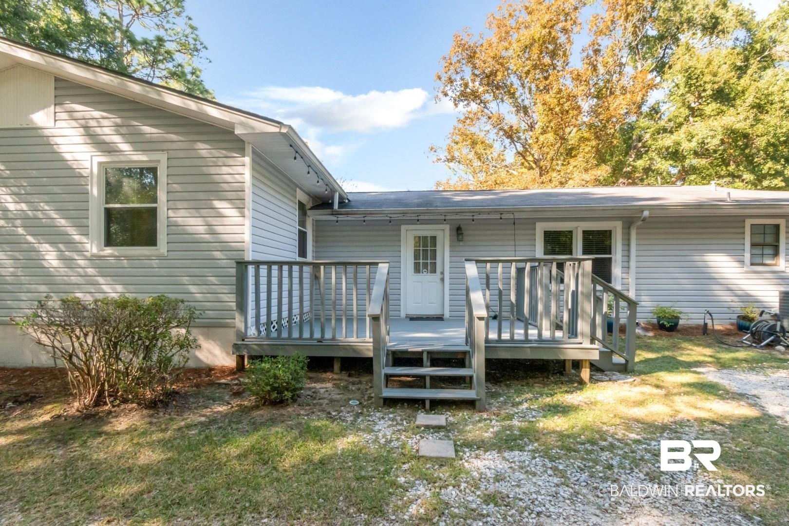 1321 Rainbow Drive West Mobile, AL 36693 - Photo 35 of 48 Back of property with a wooden deck
