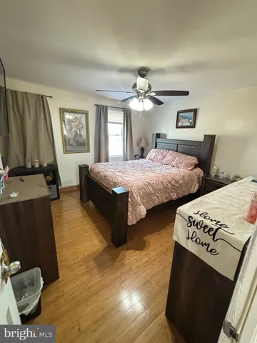 a bedroom with two beds and a flat screen tv