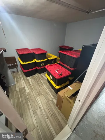 a bedroom with furniture and a rug