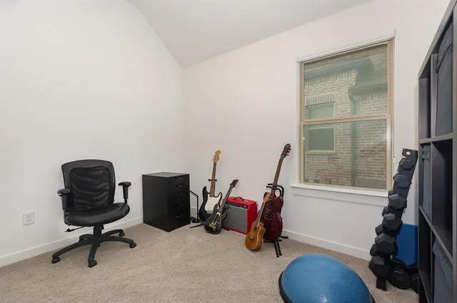 a view of workspace with furniture and a window