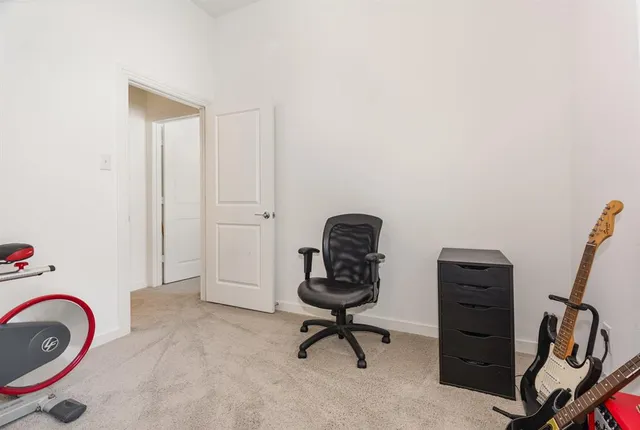 a view of a workspace with furniture