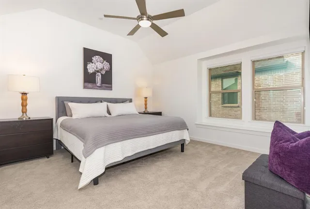 a bedroom with a bed and a couch