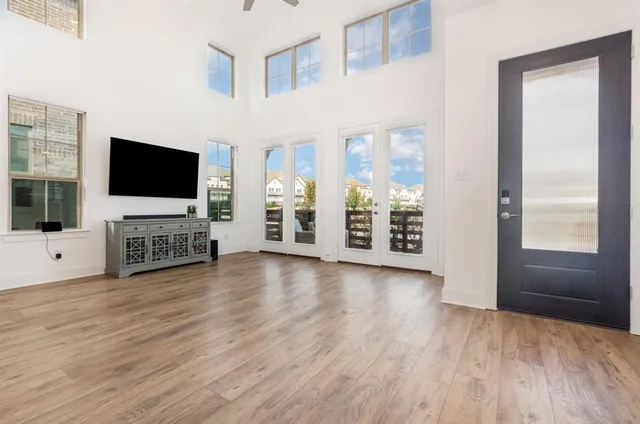 a view of a livingroom with furniture and a flat screen tv