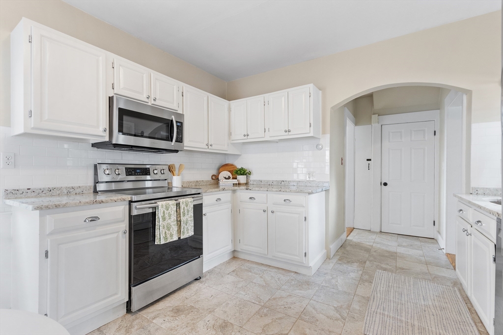 170 West Street, Unit 170 Needham, MA 02494 - Photo 11 of 32 a kitchen with cabinets stainless steel appliances and sink