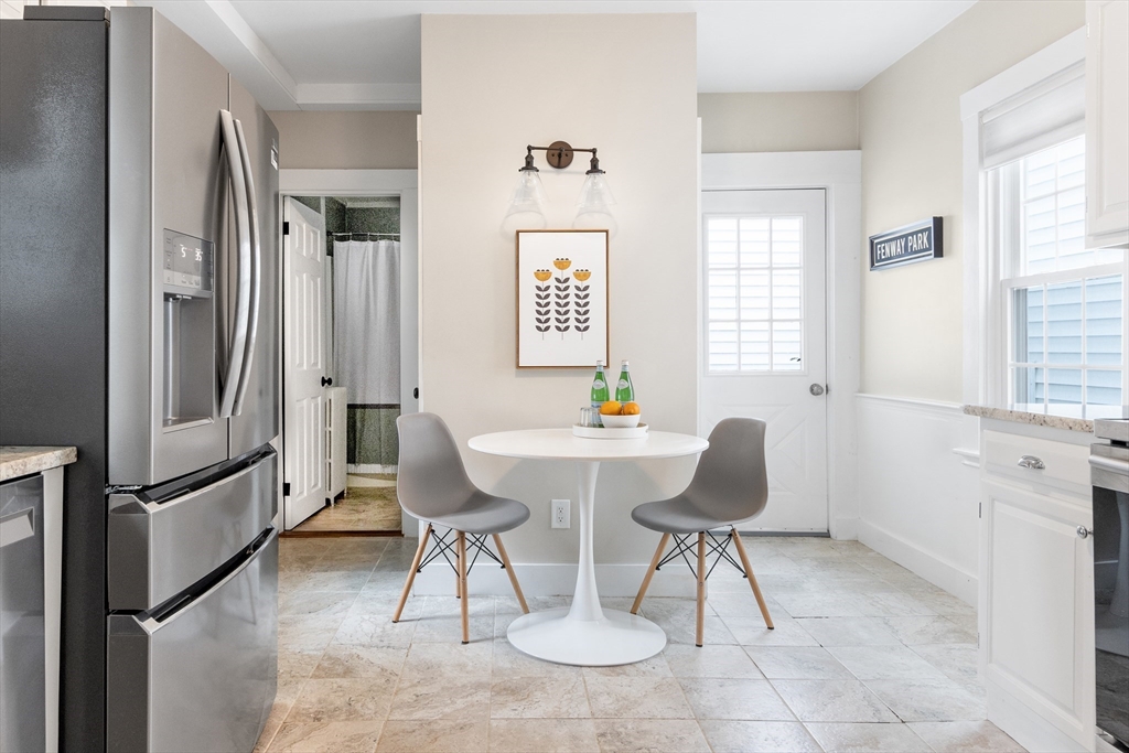 170 West Street, Unit 170 Needham, MA 02494 - Photo 12 of 32 a view of a dining room with furniture window and wooden floor