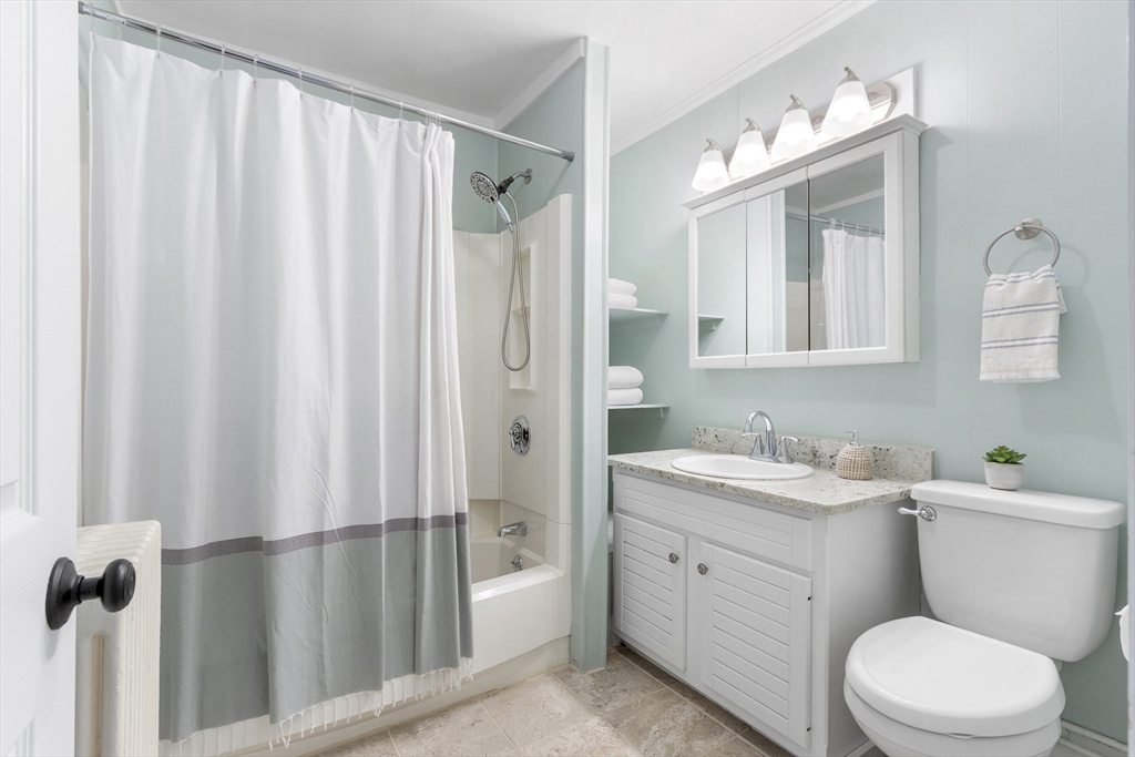 170 West Street, Unit 170 Needham, MA 02494 - Photo 14 of 32 a bathroom with a toilet a sink and a mirror