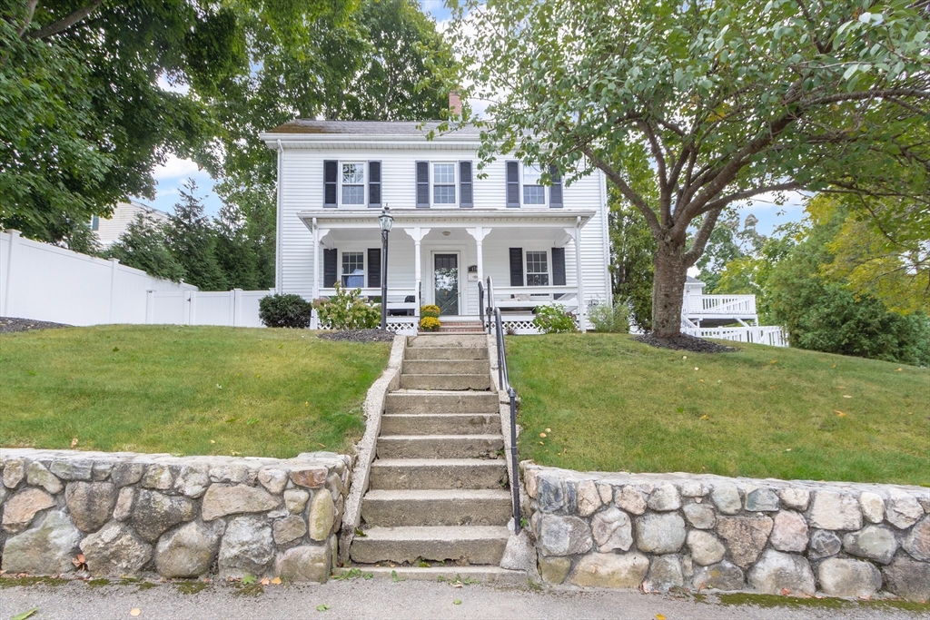 170 West Street, Unit 170 Needham, MA 02494 - Photo 2 of 32 a front view of a house with a yard