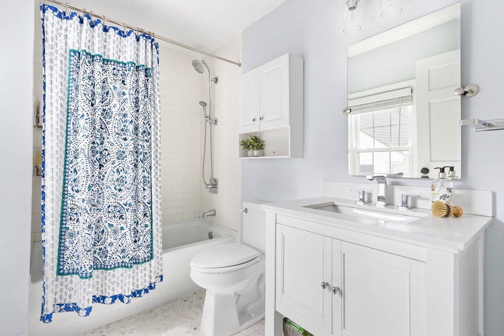 170 West Street, Unit 170 Needham, MA 02494 - Photo 21 of 32 a bathroom with a sink vanity granite toilet and shower