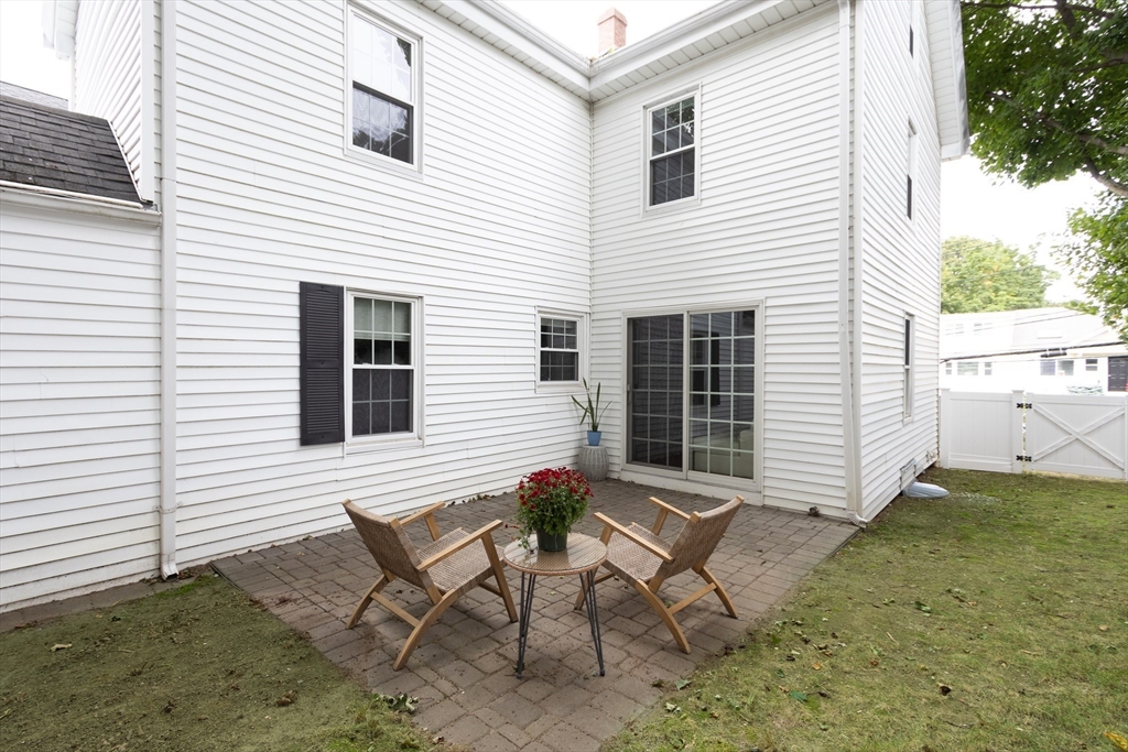 170 West Street, Unit 170 Needham, MA 02494 - Photo 25 of 32 a view of a house with backyard and sitting area