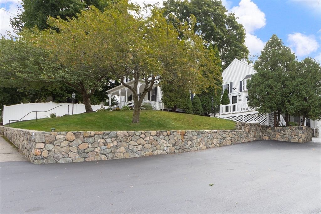 170 West Street, Unit 170 Needham, MA 02494 - Photo 27 of 32 a view of a garden with an outdoor seating