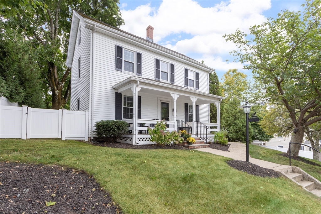 170 West Street, Unit 170 Needham, MA 02494 - Photo 30 of 32 a front view of a house with sitting area and garden