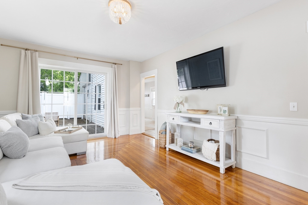 170 West Street, Unit 170 Needham, MA 02494 - Photo 8 of 32 a living room with furniture and a flat screen tv